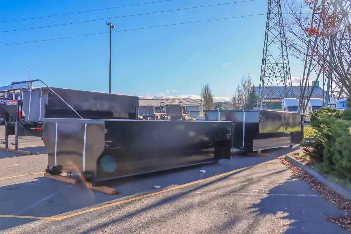 Roll-off dumpster ready for waste disposal at job site for Demolition Dumpster Rental in Huntersville